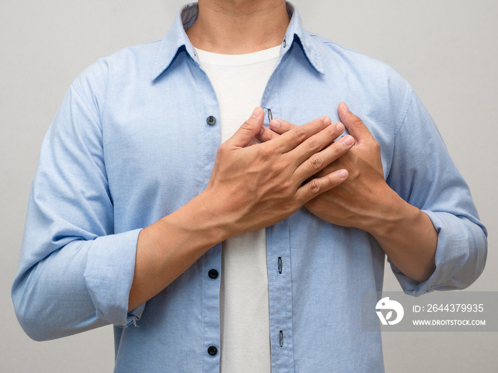 Close-up man touch his chest for lover portrait studio shot