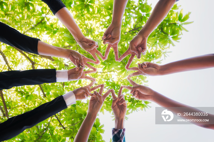 Teamwork putting their hands together,business team with stack of them hands showing unity,join hands partnership concept.