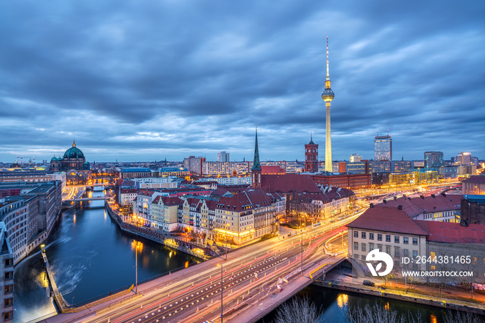 The center of Berlin with the famous TV Tower and a clouded sky at dusk