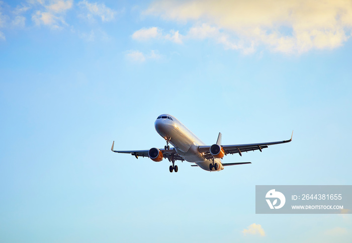 Flying airplain over blue sky