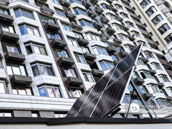 The solar battery panel mounted near modern apartment building in Kyiv, Ukraine.