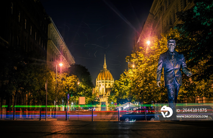 Budapest at night. The dome of the parliament building and the statue of Ronald Reagan in the city square