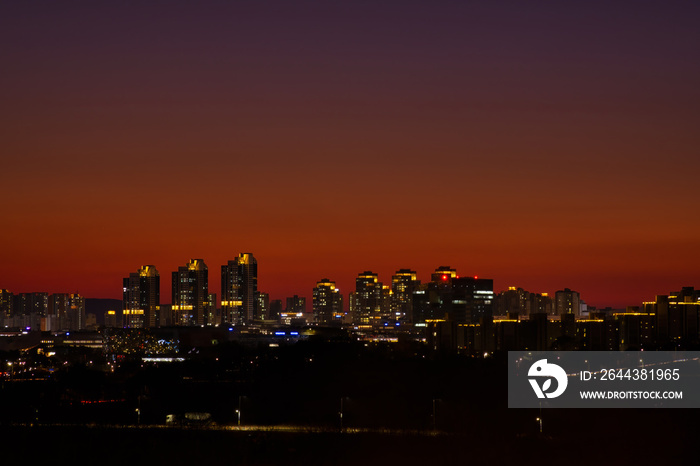 Scenic view of cityscape against sky during sunset