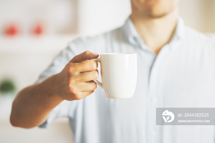 Man holding coffee cup