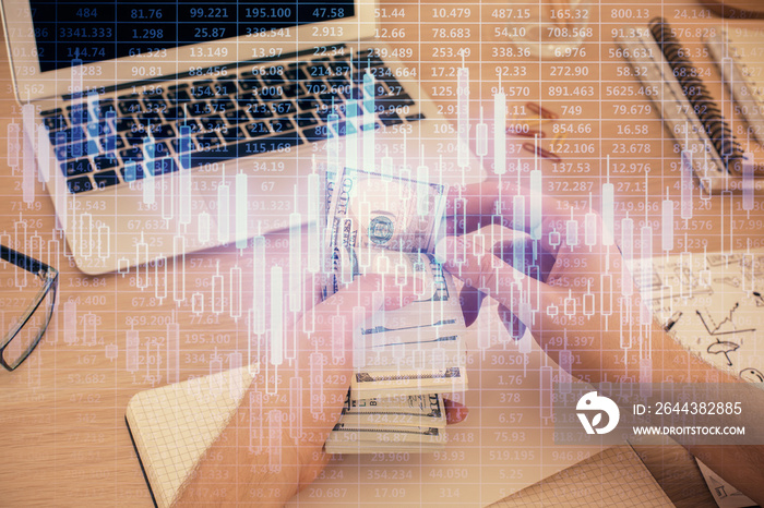 Multi exposure of financial graph drawing hologram and USA dollars bills and man hands. Analysis concept.