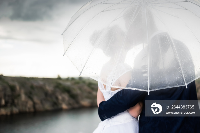 couple under an umbrella in rain