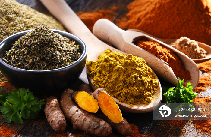 Composition with spices on wooden kitchen table