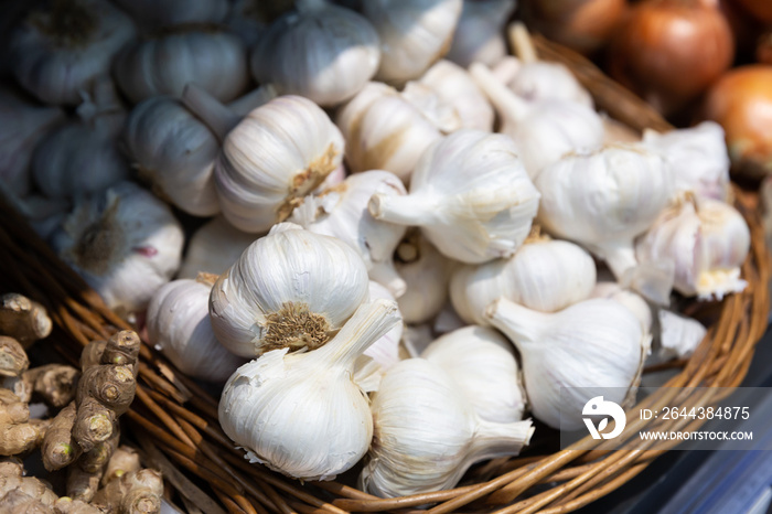 Garlic in a basket on a supermarket shelf