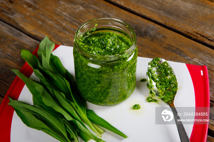 Fresh homemade wild garlic pesto. Home made sauce made with wild garlic, pine nuts, cheese and olive oil.