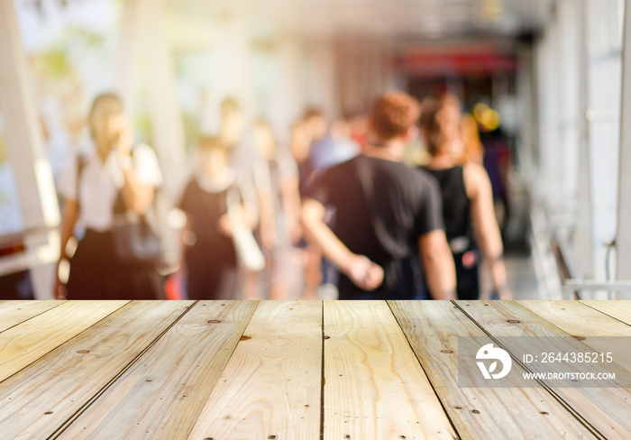 wooden floor with blurry people background.