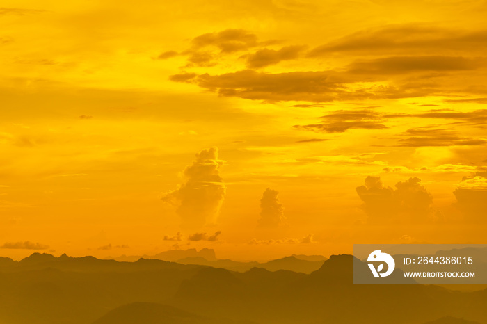 Landscape photo of sunset over clouds with mountain hill forest. in golden light tone.