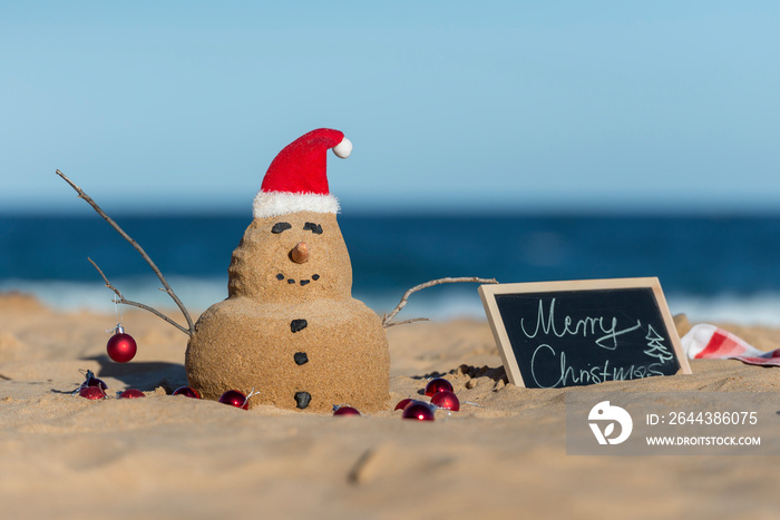 Australian Christmas Sandman with decoration on the iconic Bondi Beach in Sydney