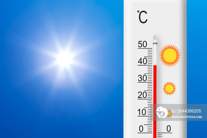 Celsius scale thermometer shows plus 40 degrees . Yellow sun in blue sky. Summer heat