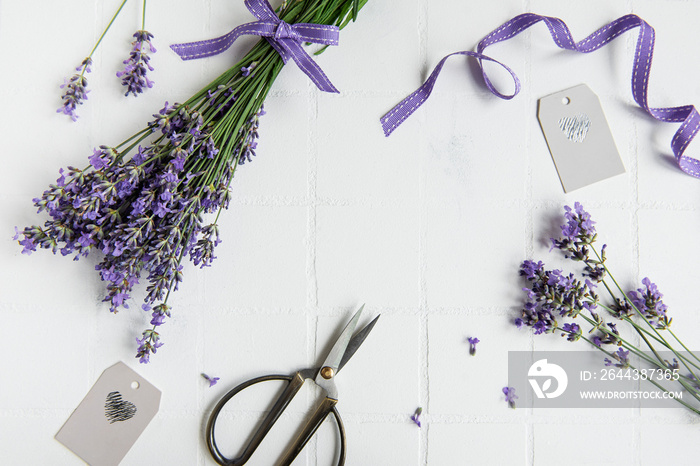 Lavender flowers, scissors and ribbon