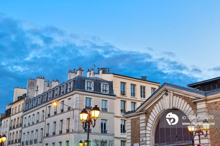 Classic architecture of builduings in Versailles city, in France at dusk