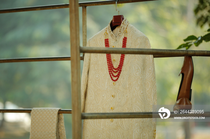 Off White sherwani With Blur Background