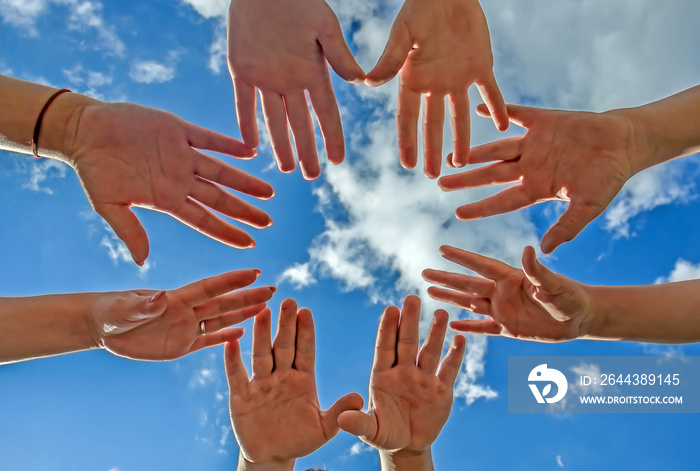 Sky with clouds and hands against the sky