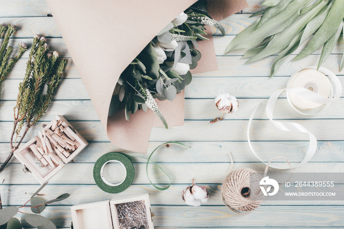 Florist workplace with flower on wooden background