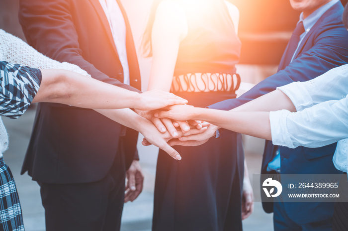 group of business people holding hands