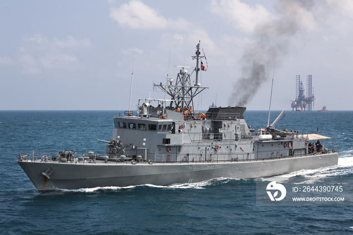 Military navy ships in a sea bay with fishing boat,view from aerial