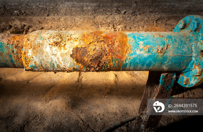 Drinking water supply system. Corrosion on the main pipe. Picture taken in Ukraine, Kiev region. Horizontal frame. Color image.