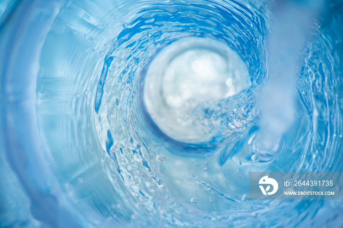 Background with a swirl of blue clear pouring water