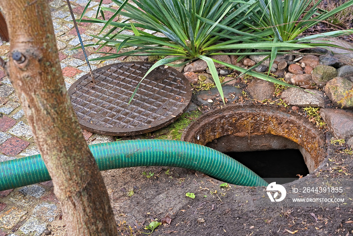 pumping septic tanks from the backyard tank in the countryside