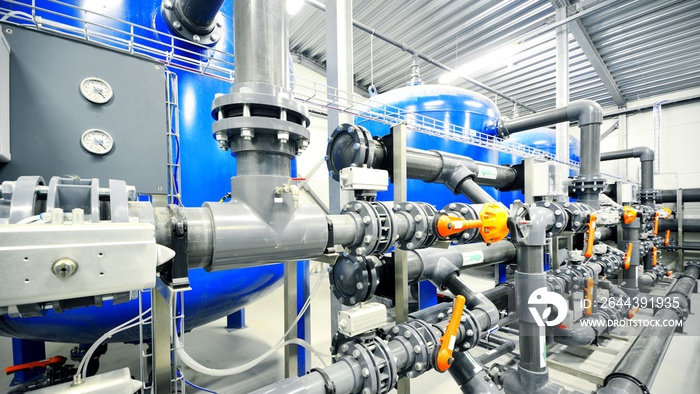 new plastic pipes and colorful equipment in industrial boiler room