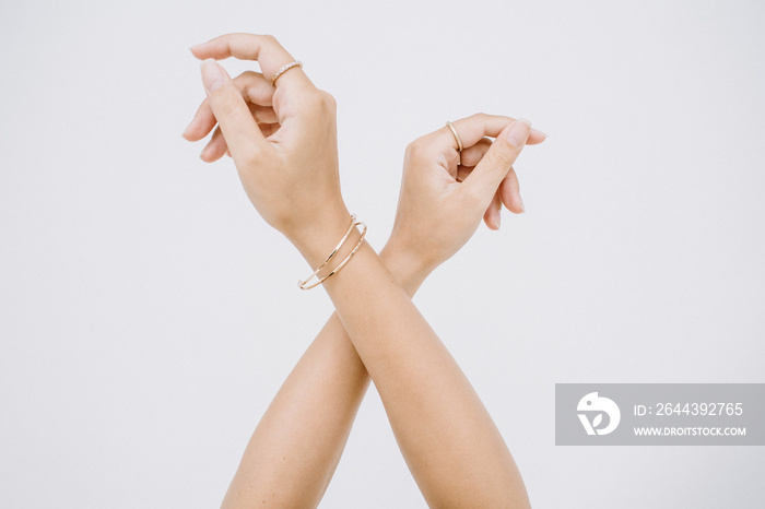 Woman hands with ring and bracelet.