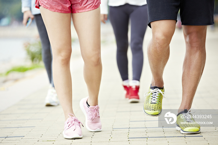 feet of people jogging in park