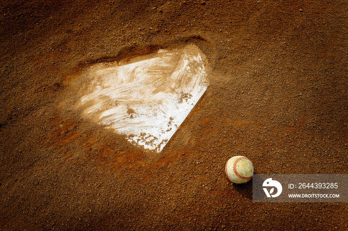 Old Leather Baseball on Field by Home Plate or Base