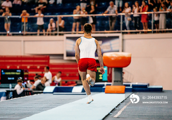 gymnast run up track perform gymnastics vault exercise