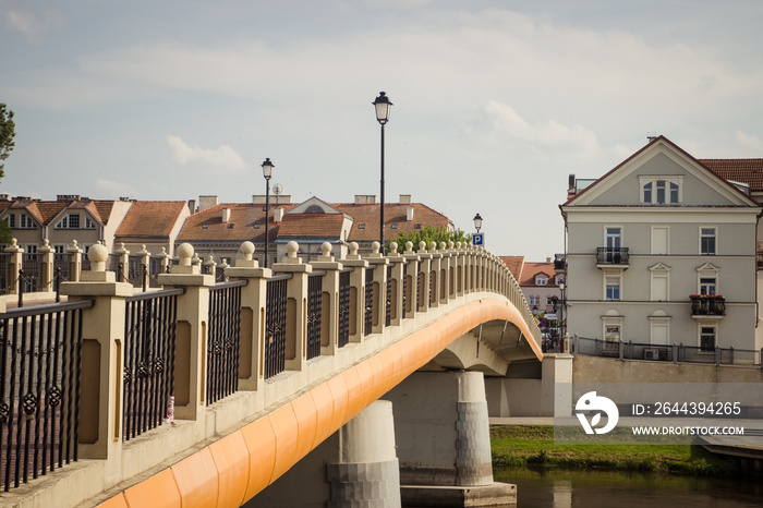 View on bridge and embankment of Warta river in polish town Konin.