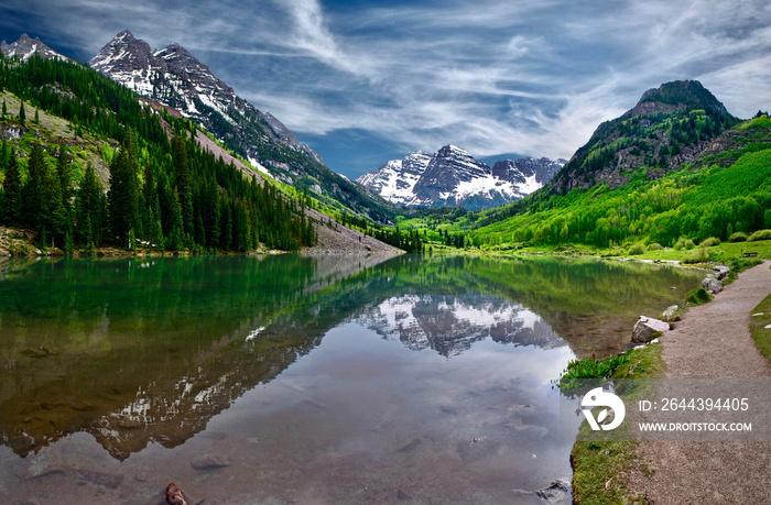 Maroon Bells reflections in calm clear water of Maroon Lake near Aspen. Colorado. United States of America