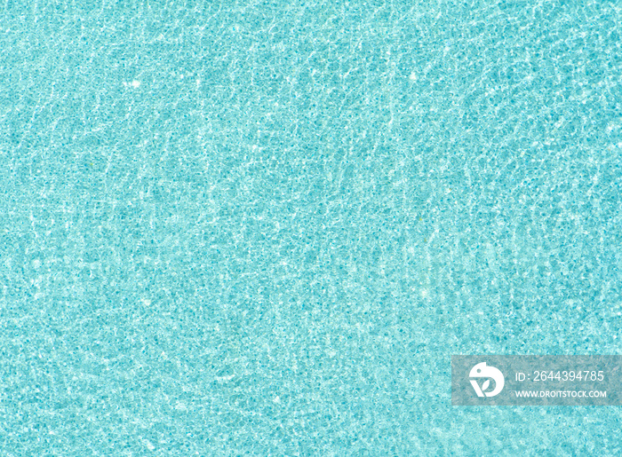 Surface of blue or turquoise swimming pool with clear water ripple waves for wallpaper in summer season. Pattern material texture. Nature background,