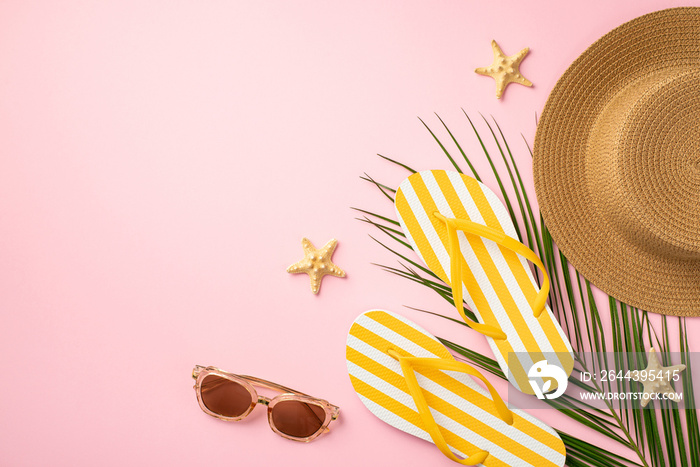 Summer rest concept. Top view photo of sunhat yellow striped flip-flops sunglasses starfishes and palm leaves on isolated pastel pink background with copyspace