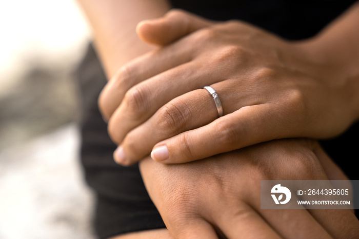 silver engagemnet ring on females hand after wedding proposal