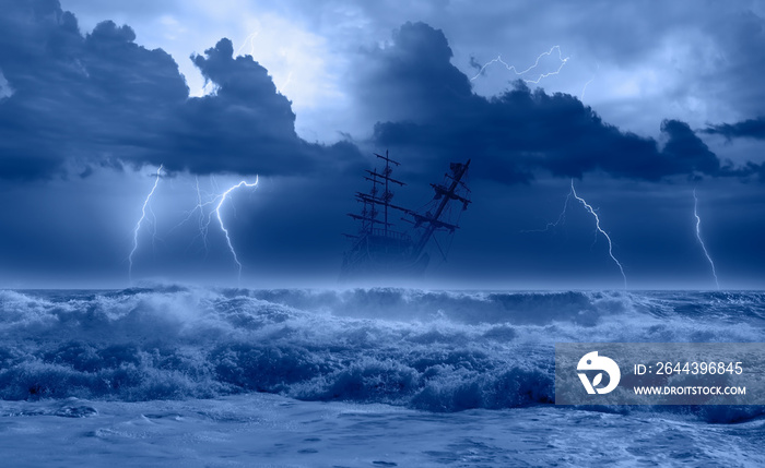 Silhouette of sailing old ship in storm sea on the background amazing lightning