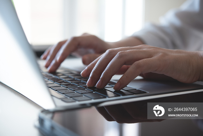 Close up, woman hands typing on laptop computer keyboard, surfing the internet on office table, online, working, business and technology, internet network communication concept