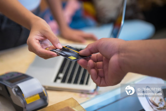 Hand Swiping Credit Card In Store