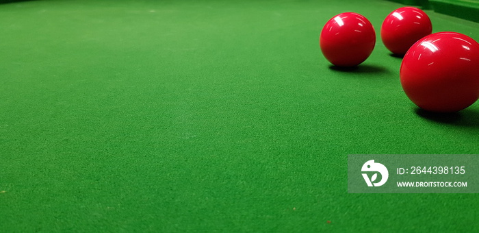 billiard balls on a green table