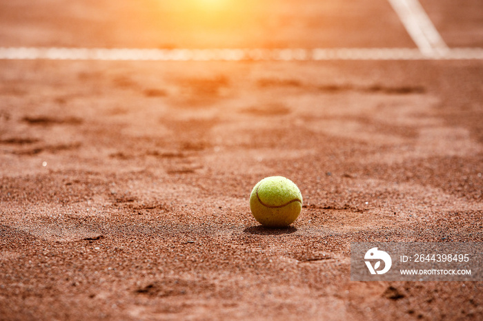 Ball on a clay tennis court.