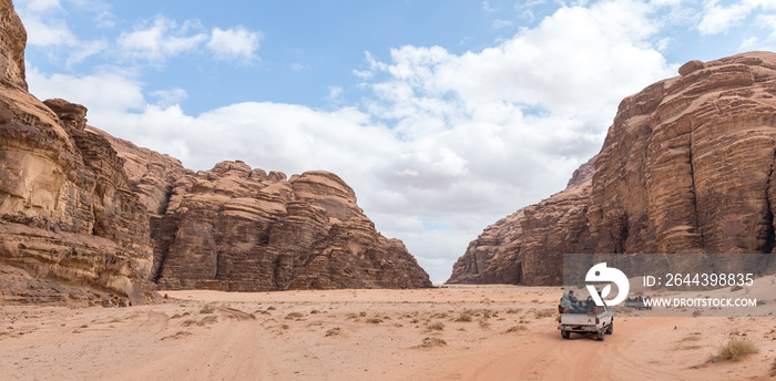 Tourists ride in open jeeps in the Wadi Rum desert near Aqaba city in Jordan