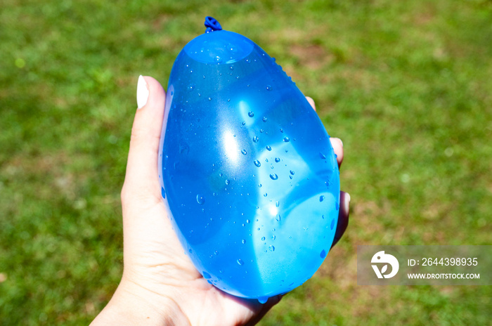 Blue water balloon, kid’s summer game