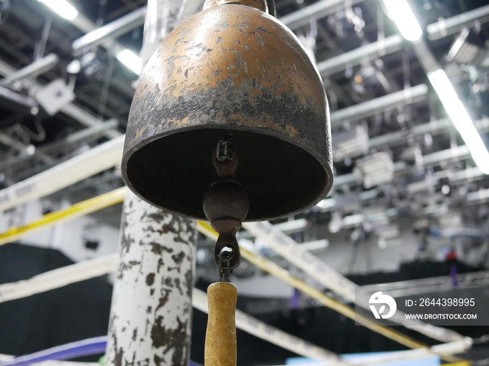 closeup of bell in boxing ring or boxing stadium.
