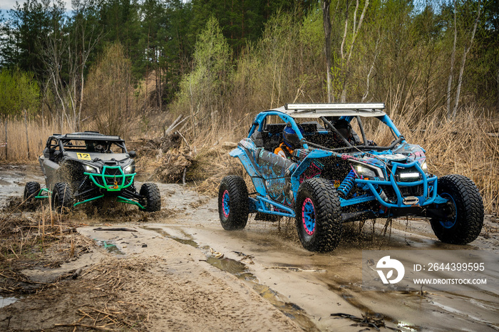 Atv vehicles in muddy water at the quad (buggy) competition