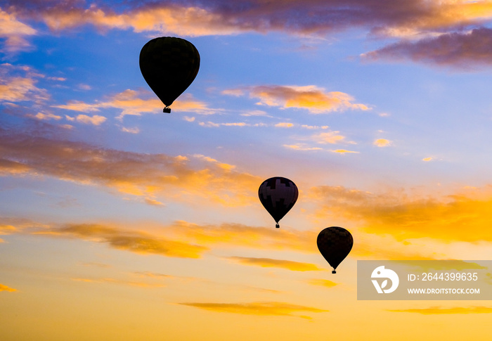 Three hot air balloons at dusk in Temecula CA