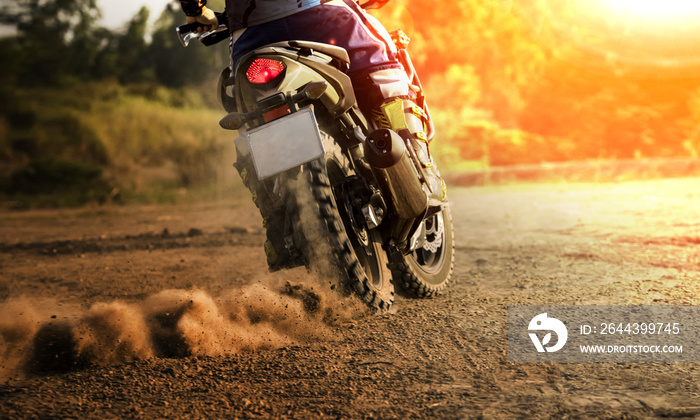 man riding sport touring motorcycle on dirt field