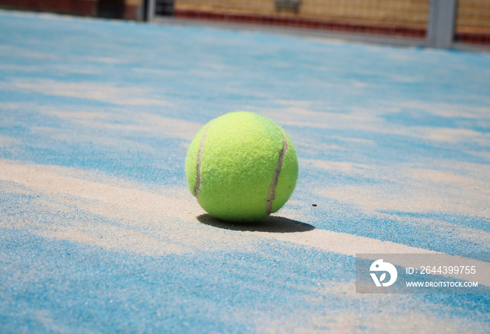 Ball of padel in the court.