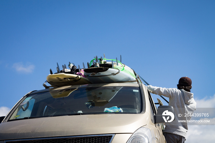 Surfboards mounted on the roof of the car. photo travel. Leisure